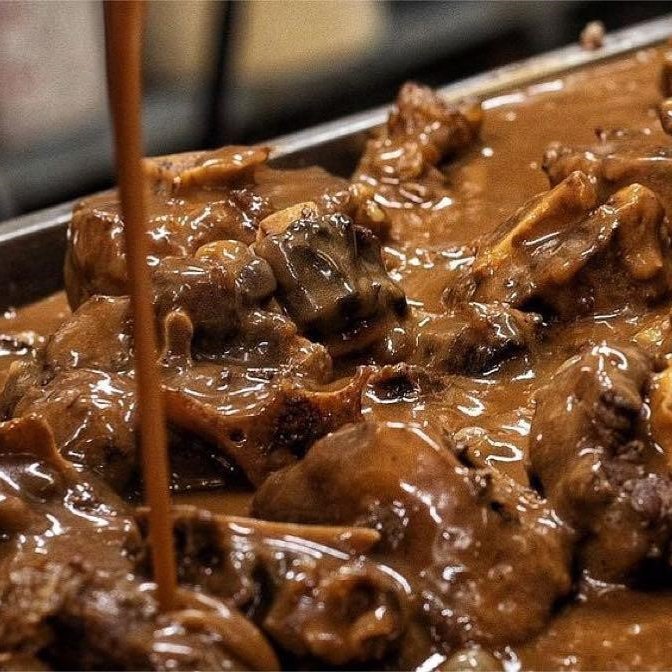 A catering tray of smoked oxtails