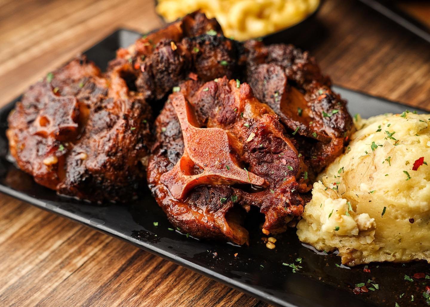 World Famous Oxtails with mashed potatoes and mac and cheese